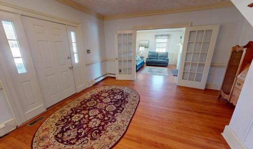 Welcoming foyer looking into formal living room.