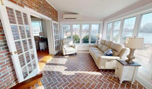 Spacious sunroom overlooking Finney Creek.