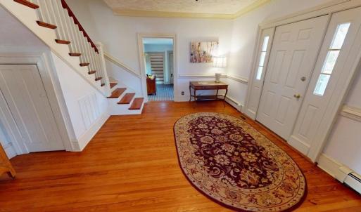 Foyer looking toward primary suite wing.