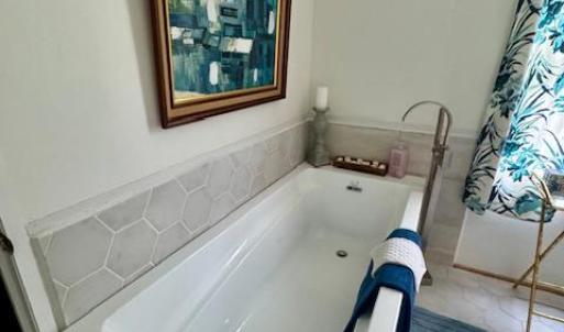 soaking tub with waterfall faucet