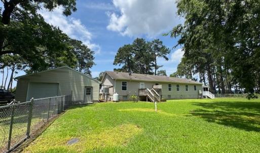 portion of rear yard is fenced for fido or kiddo
