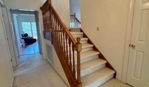 Front stair case to 2nd and 3 bedrooms.