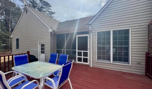 Rear deck leading into small creen porch.