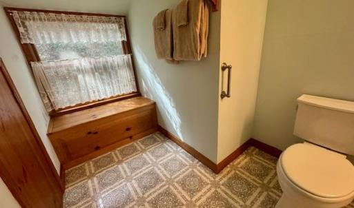 hall bath with storage bench