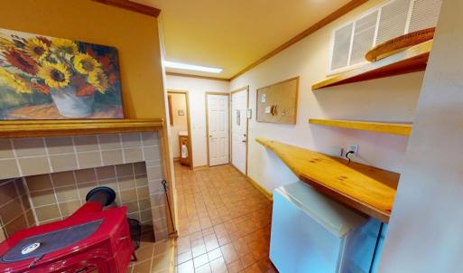 From kitchen towards 1/2 bath, garage & laundry