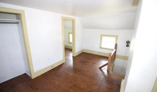 Front bedroom with stairway to kitchen