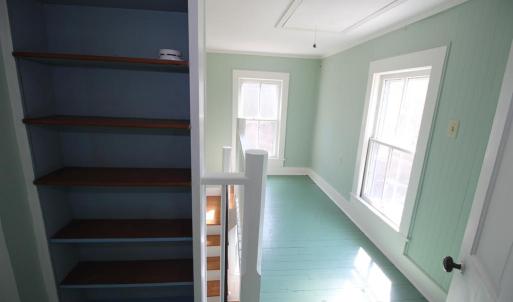 Upstairs hallway is bright and open