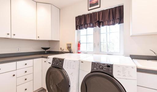 upstairs utility room with sink