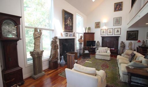 Living room, There is a wonderful creek view through the window to the left of the wood burning fireplace.