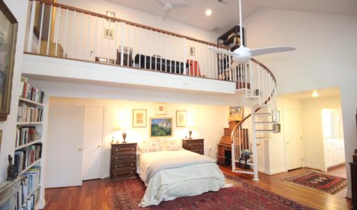 Primary suite, The master bath is to the right and it has a breathtaking creek view.