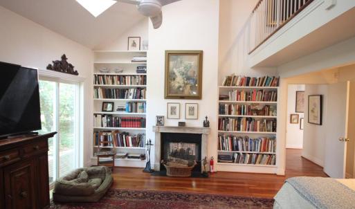 Primary suite. The study is on the the side of the wall from the fireplace and shares the "two sided fireplace" A most unusual feature.