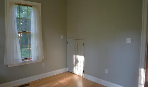 Downstairs bedroom with pantry door