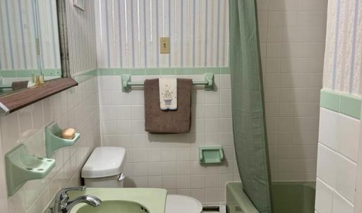 Bathroom between family room and formal living roo