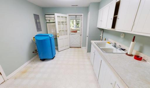 Laundry room leading out to screen porch