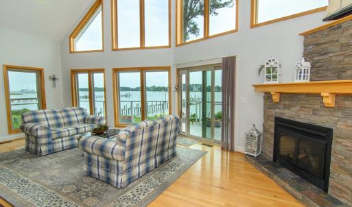 Living Room, The stone fireplace in the corner is gas with a manual switch.