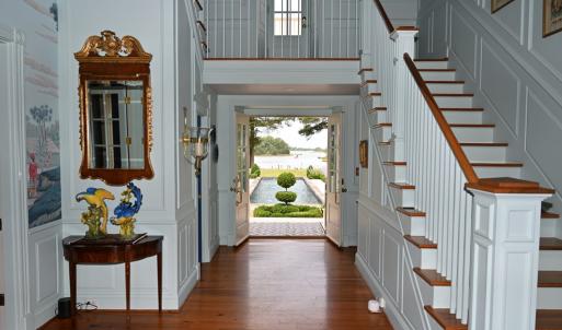 Foyer to pool view with open doors