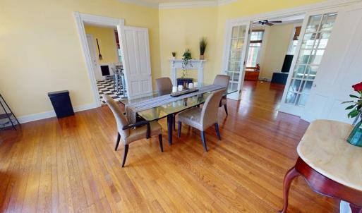 Dining room with door to kitchen and double doors