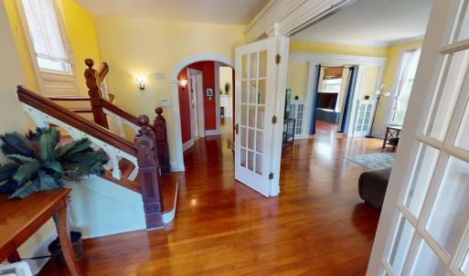 Check out this foyer and the woodwork  on the stai, Many architectural details throughout.