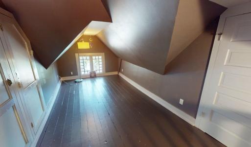 Third floor bonus room , With attic space on both ends behind those doors.