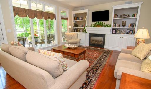 Family Room , Added Features include built in bookcases, gas fireplace, entrance to porch