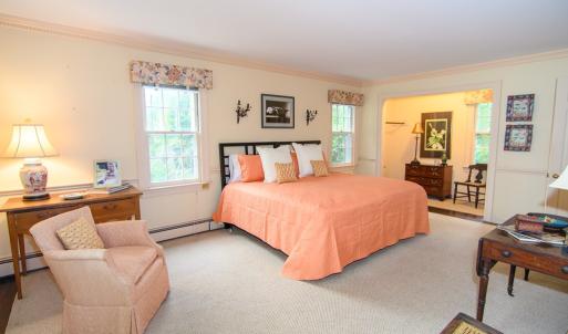 1st Floor Primary, Features include private bath, WIC, crown molding and hardwood floors.