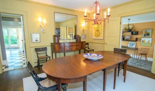 Formal Dining Room, Features include crown molding, sconces, and hardwood floors.