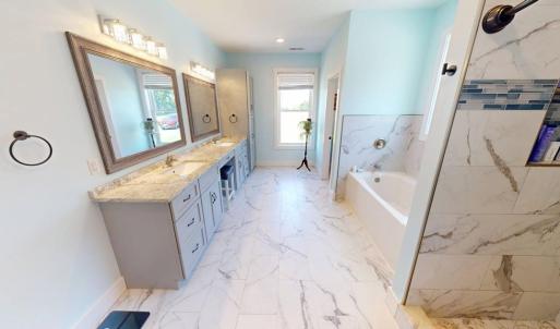 Double vanity and extra long soaking tub.