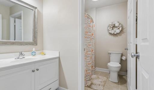 Hall Full Bath with separate private tub and toilet room.