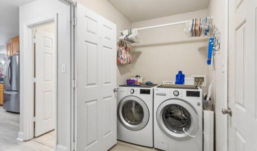 Utility room w/sink, laundry and entrance to 2 car attached garage