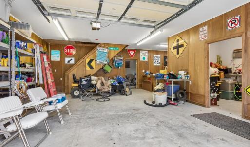 Detached garage with finished office space, workshop, and large back room with a sink.