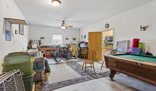 Large room in detached garage, behind the garage bay, plumbed with a sink.