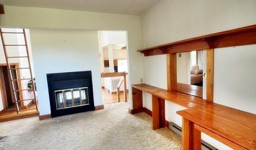 Area above living room 2-sided fireplace