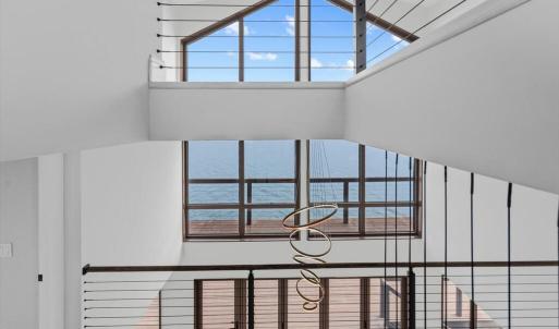 Dramatic 2 Story Windows with Water Views