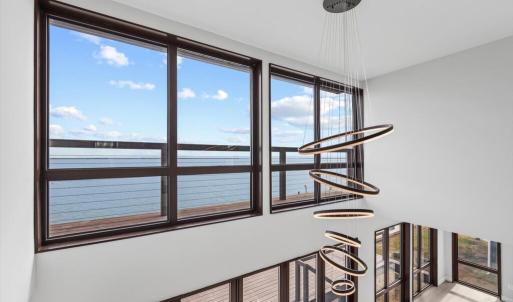 Dramatic 2 Story Windows with Water Views