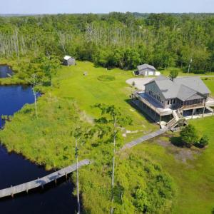 Photo of UNDER CONTRACT!  Waterfront Home with 11 Acres of Land For Sale in Tyrrell County NC!