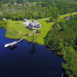 Photo of UNDER CONTRACT!  Waterfront Home with 11 Acres of Land For Sale in Tyrrell County NC!