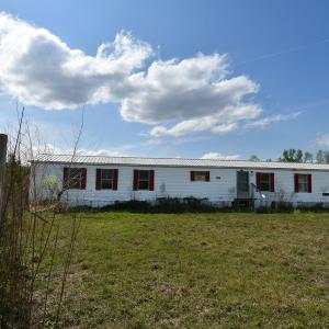 Manufactured / mobile home featuring metal roof an