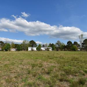 View of yard with a rural view