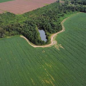 Aerial view of property's location with farmland,