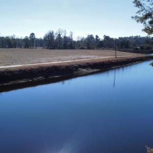 Water view featuring a heavily wooded area