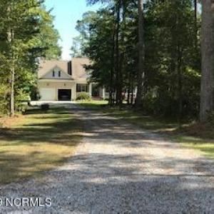Private home setting on wooded lot