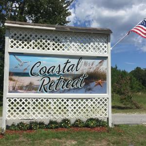 Coastal Retreat Sign