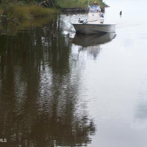 Boat navigating Mill Creek