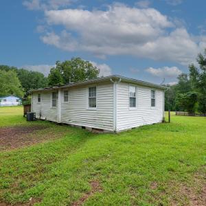 rear of uninhabitable home on property