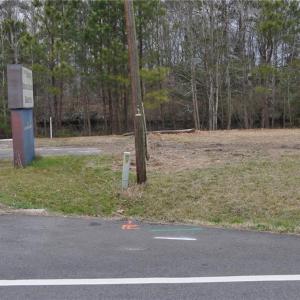 SE lot corner with Canal view in rear