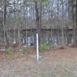 SW lot corner next to Canal marked near Post