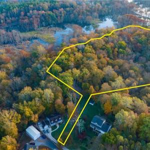 Aerial view of property with lot lines superimposed. Note, location of lot lines is approximate.