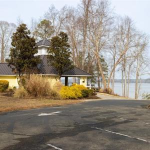 parking lot and pool house with river
