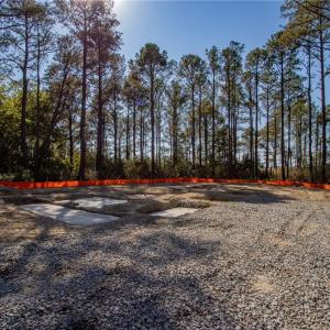 Quick picture of a new home being built on the same road...two lots down from this one! This street is ready for your new home as well!!