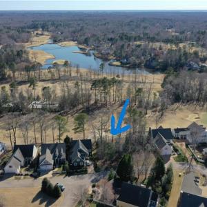 Aerial View of 128 Highland, golf course and pond beyond